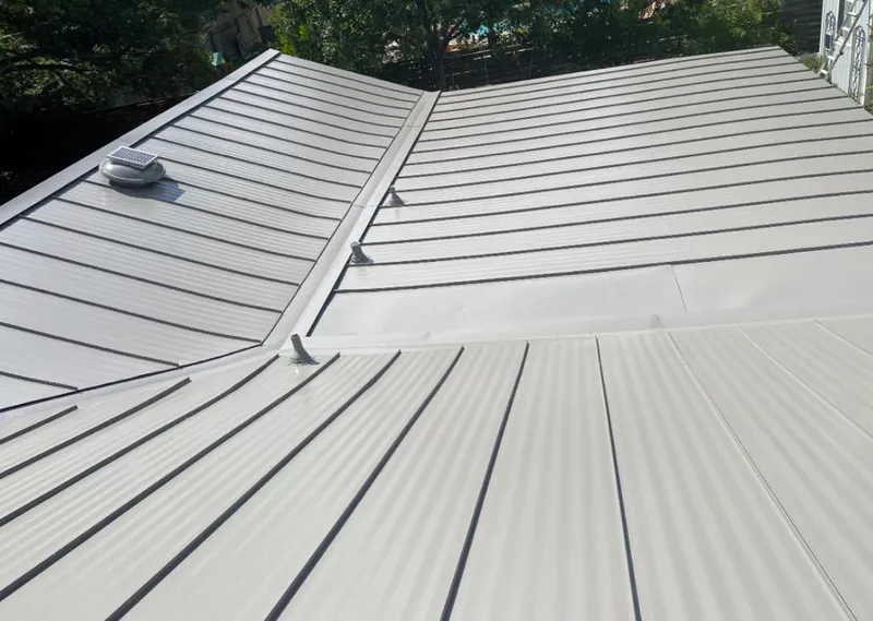 Solar attic fan installed on a metal roof for Roof Ventilation in North Port